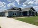 Charming single story home featuring a well-manicured lawn and an attached two car garage at 8290 Nw 17Th Cir, Ocala, FL 34475