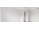 Bright, white bedroom with a doorway leading to another room at 8465 Sw 101St Ave, Ocala, FL 34481