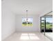 Bright dining area with stylish chandelier and sliding glass doors to the backyard at 8465 Sw 101St Ave, Ocala, FL 34481