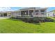Charming one-story home showcasing a lush green lawn and inviting covered porch with stylish accents at 8465 Sw 101St Ave, Ocala, FL 34481