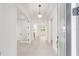 Bright and spacious foyer with tile flooring and contemporary lighting fixtures at 8465 Sw 101St Ave, Ocala, FL 34481