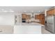 Modern kitchen with a large center island, stainless steel appliances, and ample cabinet space at 8465 Sw 101St Ave, Ocala, FL 34481