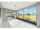 Covered lanai offering a view of the backyard through screened openings, perfect for relaxing at 8465 Sw 101St Ave, Ocala, FL 34481
