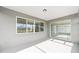 View of covered lanai with sliding glass doors and multiple windows at 8465 Sw 101St Ave, Ocala, FL 34481