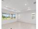 Bright and airy living room with large windows and recessed lighting at 8465 Sw 101St Ave, Ocala, FL 34481