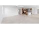 Spacious living area open to the kitchen, featuring modern tile flooring at 8465 Sw 101St Ave, Ocala, FL 34481