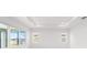 Well-lit living room featuring neutral colors and large windows at 8465 Sw 101St Ave, Ocala, FL 34481