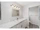 Bright bathroom features marble countertop, large mirror, modern vanity, and tiled shower at 8998 Sw 94Th St # D, Ocala, FL 34481