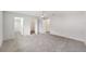 Expansive bedroom features ceiling fan, neutral paint, carpet flooring, and access to walk-in closet at 8998 Sw 94Th St # D, Ocala, FL 34481