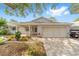 Charming single-story home with a brick facade, covered porch, and beautifully landscaped front yard at 8998 Sw 94Th St # D, Ocala, FL 34481