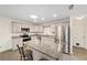 Bright kitchen features granite countertops, stainless appliances, and a center island with breakfast bar at 8998 Sw 94Th St # D, Ocala, FL 34481