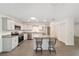 Modern kitchen features stainless steel appliances, granite countertops, and a convenient island with seating at 8998 Sw 94Th St # D, Ocala, FL 34481