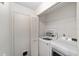 Laundry room features a new washer, dryer and shelving, and utility closet at 8998 Sw 94Th St # D, Ocala, FL 34481