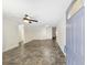 Bright, open-concept living room features neutral walls, ceiling fan and durable flooring at 8998 Sw 94Th St # D, Ocala, FL 34481