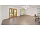 Bright and open living space featuring French doors and a neutral color scheme with an open concept at 8998 Sw 94Th St # D, Ocala, FL 34481