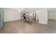 Modern open-concept living space with updated kitchen, stainless appliances, and stylish breakfast bar seating at 8998 Sw 94Th St # D, Ocala, FL 34481