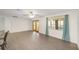 Modern open-concept living space with updated kitchen, stainless appliances, and stylish breakfast bar seating at 8998 Sw 94Th St # D, Ocala, FL 34481