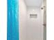 Modern shower featuring subway tile, a niche, and glass door at 8998 Sw 94Th St # D, Ocala, FL 34481