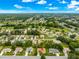 Expansive aerial view of the community, highlighting the home's location with a red arrow at 9131 Se 135Th St, Summerfield, FL 34491