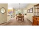 Inviting dining room with chandelier lighting and direct access to the kitchen and living spaces at 9131 Se 135Th St, Summerfield, FL 34491