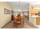 Bright dining room that offers ample natural light and a view into the living room at 9131 Se 135Th St, Summerfield, FL 34491