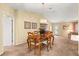 Formal dining room with elegant light fixture and easy access to other living areas at 9131 Se 135Th St, Summerfield, FL 34491