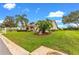 Charming single-story home showcasing manicured landscaping and a well-maintained lawn at 9131 Se 135Th St, Summerfield, FL 34491