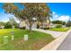 Charming single-story home with a well-manicured lawn, landscaping, and a two-car garage at 9131 Se 135Th St, Summerfield, FL 34491