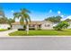 Charming single-story home with a well-manicured lawn, mature landscaping, and a welcoming curb appeal on a sunny day at 9131 Se 135Th St, Summerfield, FL 34491