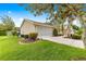 A charming home featuring an attached two car garage with driveway and manicured landscaping at 9131 Se 135Th St, Summerfield, FL 34491