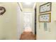 Hallway with access to closet and bathroom with tiled shower at 9131 Se 135Th St, Summerfield, FL 34491