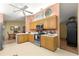Spacious kitchen with oak cabinets, modern appliances, and a seamless design at 9131 Se 135Th St, Summerfield, FL 34491