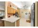 Functional kitchen with ample counter space and oak cabinets for storage at 9131 Se 135Th St, Summerfield, FL 34491