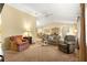 Open living area with neutral tones, offering a glimpse into the dining area, creating a warm and inviting atmosphere at 9131 Se 135Th St, Summerfield, FL 34491
