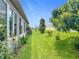 Expansive backyard showing healthy lawn, landscaping and an attractive perimeter fence at 9237 Sw 60Th Terrace Rd, Ocala, FL 34476