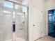 Modern bathroom featuring glass shower with tiled walls and a built-in seat at 9237 Sw 60Th Terrace Rd, Ocala, FL 34476