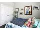 Cozy bedroom with a charming bed, colorful bedding, and decorative artwork creating a warm and inviting atmosphere at 9237 Sw 60Th Terrace Rd, Ocala, FL 34476