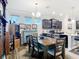 Bright dining room with elegant furnishings, including a dining table, chairs, and fireplace at 9237 Sw 60Th Terrace Rd, Ocala, FL 34476