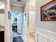 Hallway with decorative trim, leading to the front door and an office space at 9237 Sw 60Th Terrace Rd, Ocala, FL 34476