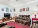 Comfortable living room with leather reclining sofa, decorative rug and stylish decor at 9237 Sw 60Th Terrace Rd, Ocala, FL 34476