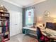Bright office space featuring a desk, chair, and ample storage with neutral walls and natural light at 9237 Sw 60Th Terrace Rd, Ocala, FL 34476