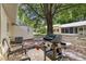 The backyard features mature trees for shade and an outdoor grill at 9290 Sw 89Th Ter # D, Ocala, FL 34481