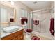 Bathroom features a modern sink with a spacious walk-in shower at 9290 Sw 89Th Ter # D, Ocala, FL 34481