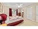 Cozy bedroom features neutral colors, a ceiling fan, and access to an en-suite bathroom for convenience at 9290 Sw 89Th Ter # D, Ocala, FL 34481