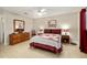 Cozy bedroom features a ceiling fan, nice furnishings, and neutral paint at 9290 Sw 89Th Ter # D, Ocala, FL 34481