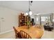 Bright dining room featuring a wooden table, chairs, and seamless access to the living area at 9290 Sw 89Th Ter # D, Ocala, FL 34481