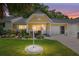 Charming yellow home featuring a well-manicured lawn and cozy front porch at 9290 Sw 89Th Ter # D, Ocala, FL 34481