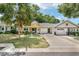 Inviting yellow home with a well-maintained lawn and a quaint front porch at 9290 Sw 89Th Ter # D, Ocala, FL 34481
