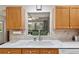 A kitchen sink featuring a window above providing natural light and a view of the exterior at 9290 Sw 89Th Ter # D, Ocala, FL 34481