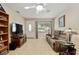 Inviting living room featuring wood-look floors, a cozy couch, and natural light at 9290 Sw 89Th Ter # D, Ocala, FL 34481